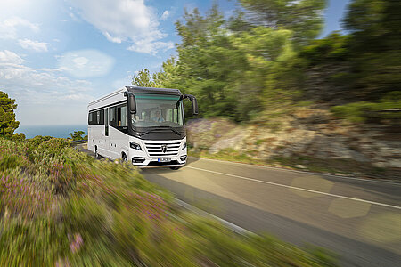 Image of a Morelo motorhome driving on a country road