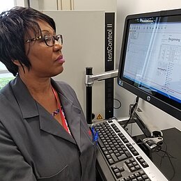 Woman standing in front of a computer