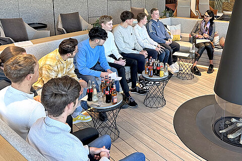 The new apprentices and Ms. Mekelburger in the lounge during the get-to-know-you session