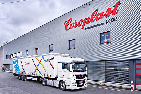 Coroplast Tape truck in front of production building