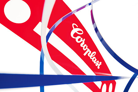 Image of a red die-cut part and other adhesive solutions