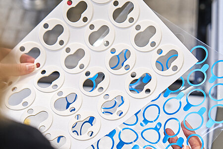 Picture of an employee producing die-cut parts for ovens