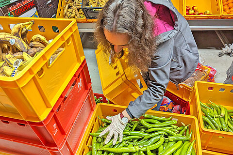 Apprentice sorting fruit and vegetable donations