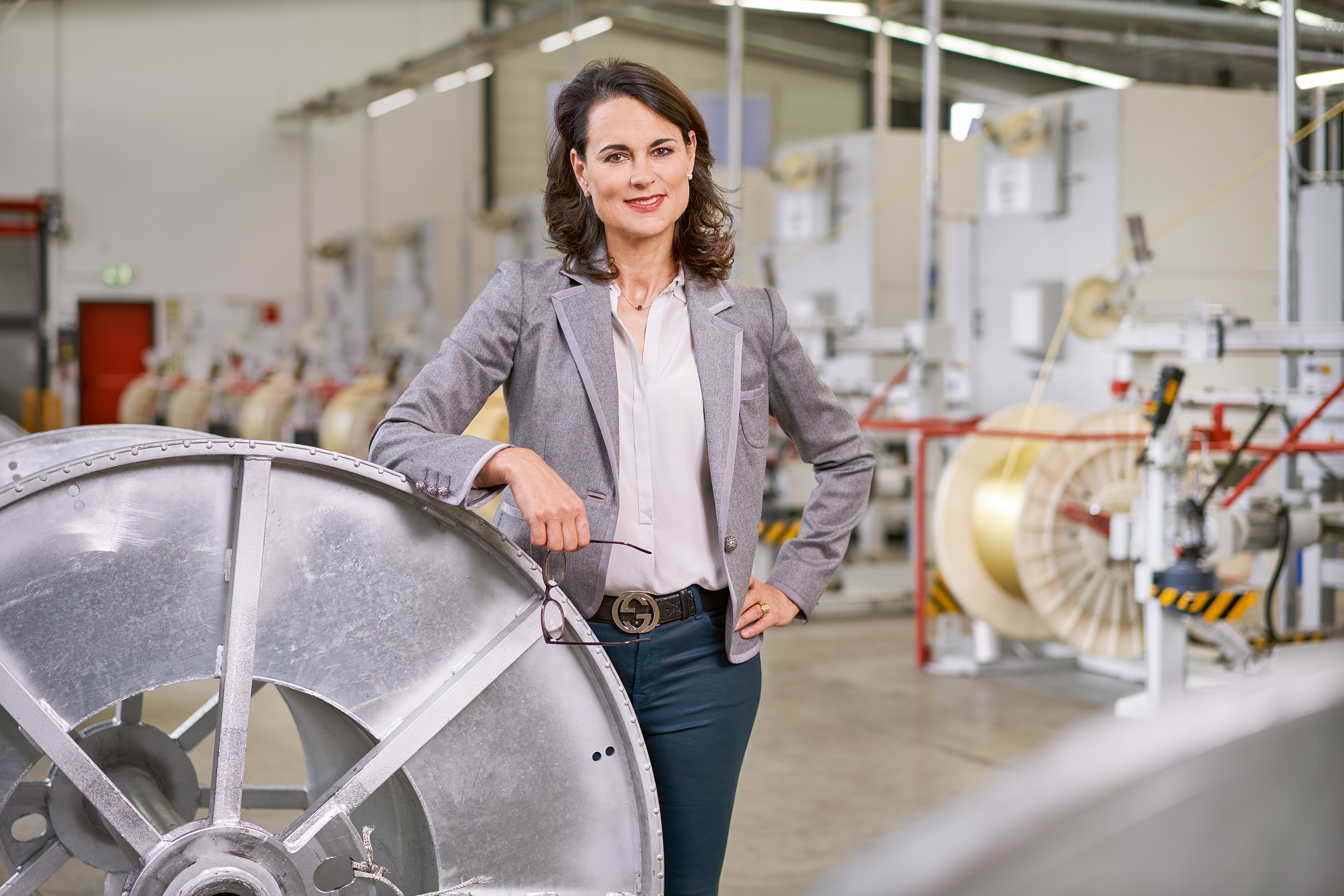 Photo of Natalie Mekelburger in a shop floor of the Coroplast Group